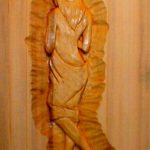 Alaskan Yellow Cear sauna door carving woman in towel