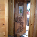 Carved Walnut door with stained glass