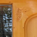 Trim carving, pine cones, plank door