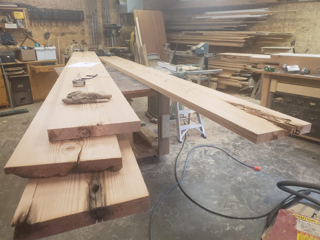 Slabs from 100 year old Doug Fir Beams for custom table being built by John Huisman